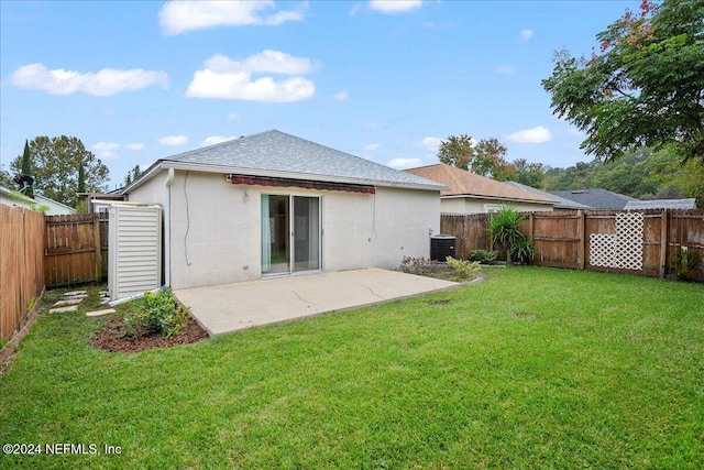 back of house featuring a shingled roof, a patio area, stucco siding, and central air condition unit