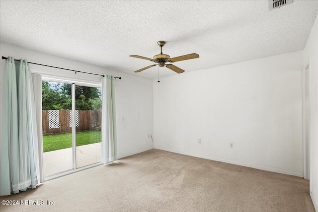 unfurnished room with light carpet, a textured ceiling, and ceiling fan