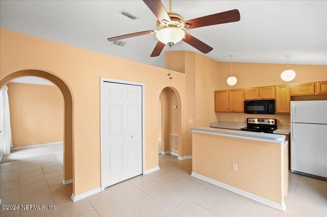 kitchen with freestanding refrigerator, black microwave, arched walkways, electric range, and lofted ceiling