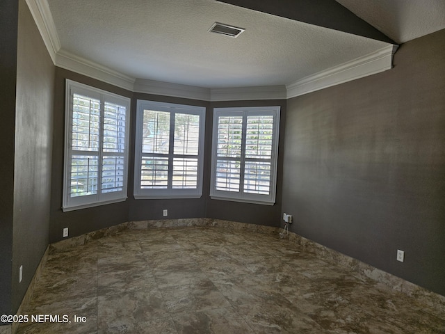 empty room featuring a textured ceiling, visible vents, and crown molding