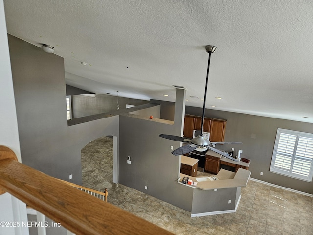 details featuring a textured ceiling and baseboards