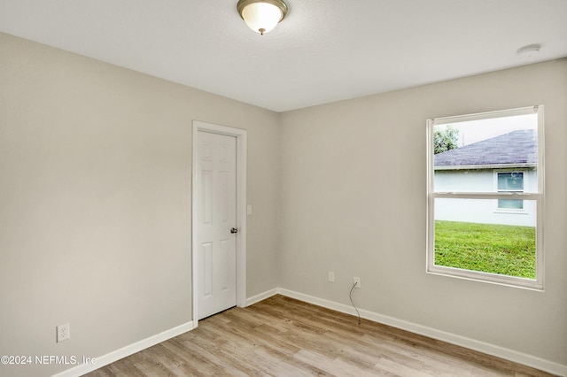 8956 3rd Ave, Jacksonville, FL 32208 - spare room with baseboards, light wood-style flooring, and a smoke detector