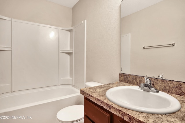 full bathroom with vanity, shower / bathtub combination, and toilet