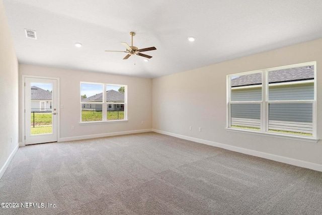 empty room featuring a ceiling fan, recessed lighting, light carpet, and baseboards