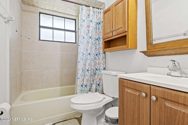 full bathroom featuring vanity, shower / bath combo with shower curtain, and toilet