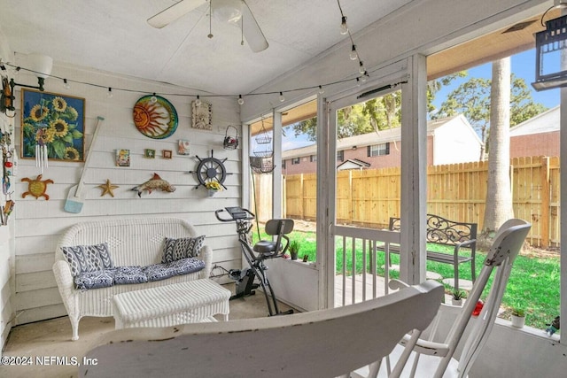 sunroom / solarium with ceiling fan