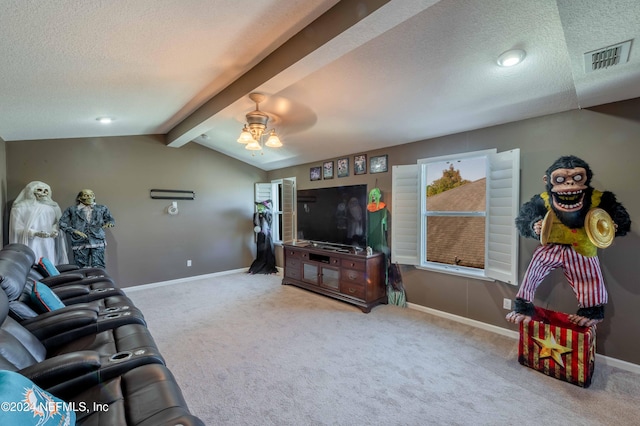 living room with a textured ceiling, carpet floors, ceiling fan, and vaulted ceiling with beams