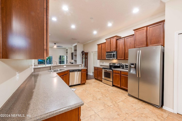 kitchen with light tile patterned flooring, appliances with stainless steel finishes, crown molding, and sink