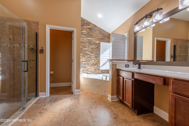 bathroom with vanity, separate shower and tub, and high vaulted ceiling