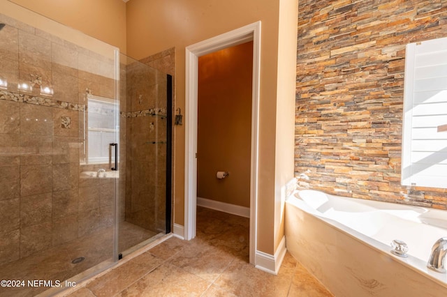 bathroom featuring tile patterned floors and plus walk in shower