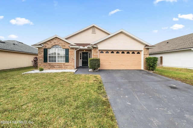 single story home with a front yard and a garage