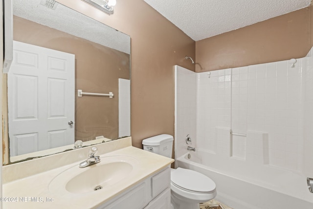 full bathroom featuring vanity, a textured ceiling, toilet, and shower / bath combination