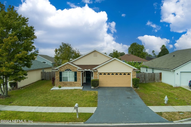 ranch-style house with a garage and a front lawn