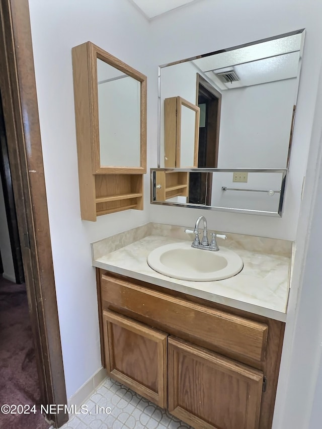 bathroom featuring vanity and tile patterned floors