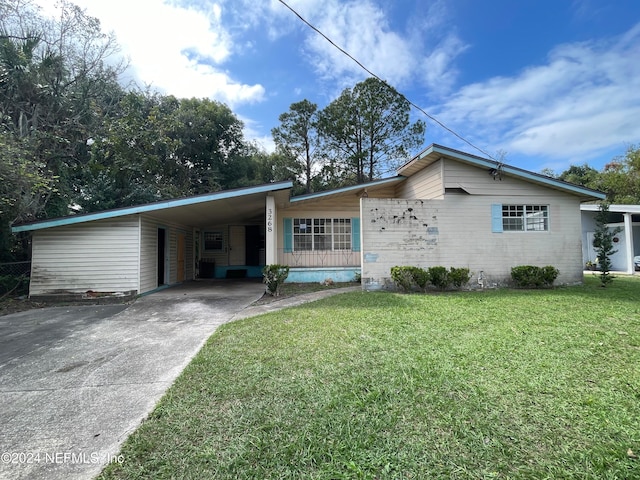 ranch-style house with a front lawn and a carport