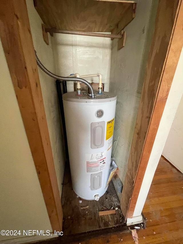 utility room with electric water heater