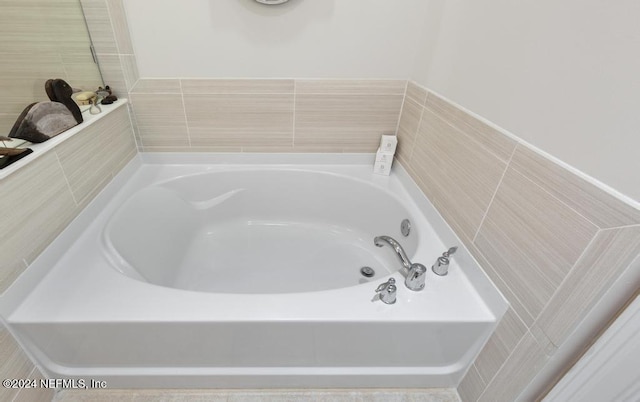 bathroom featuring a washtub