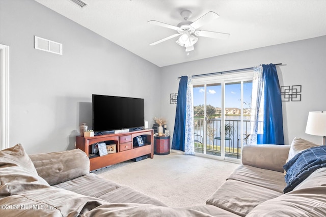 living room with lofted ceiling, carpet floors, and ceiling fan