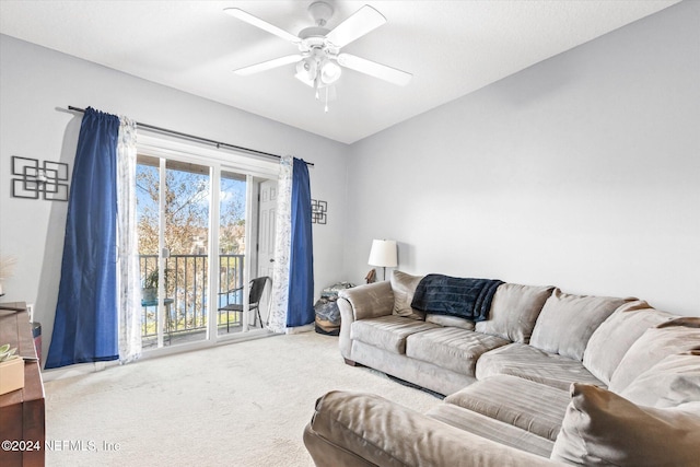 living room with carpet floors and ceiling fan