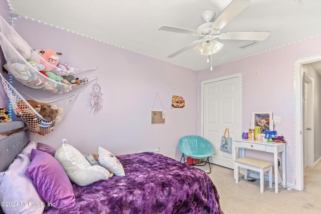 carpeted bedroom featuring ceiling fan