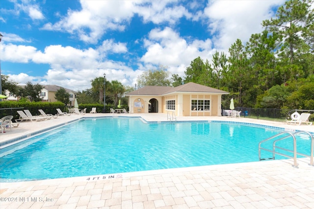 view of swimming pool featuring a patio area