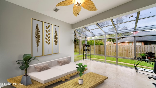 sunroom / solarium featuring lofted ceiling and ceiling fan