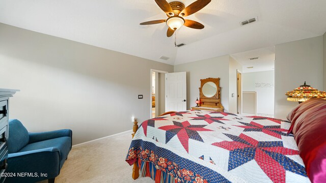 bedroom featuring ceiling fan, vaulted ceiling, and light colored carpet