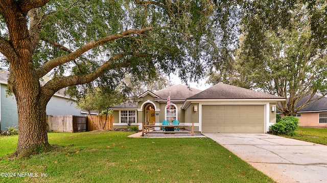 ranch-style house with a front yard and a garage