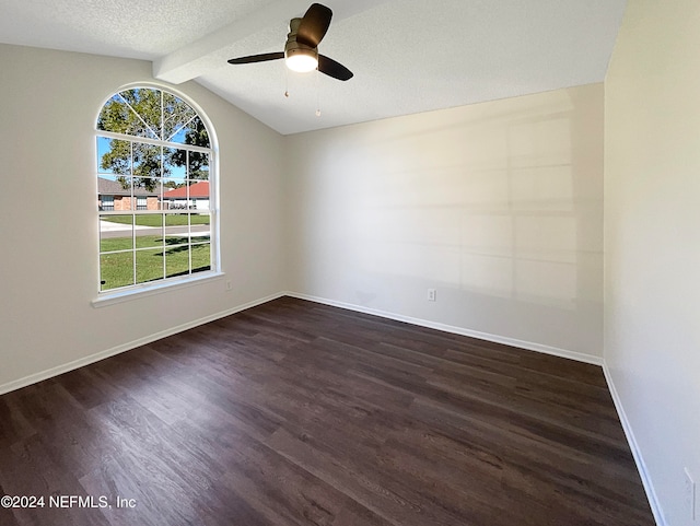 spare room featuring vaulted ceiling with beams, a textured ceiling, ceiling fan, and dark hardwood / wood-style flooring