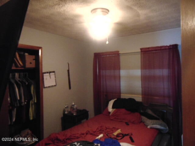 bedroom with a textured ceiling