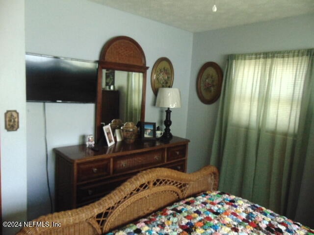 bedroom featuring a textured ceiling