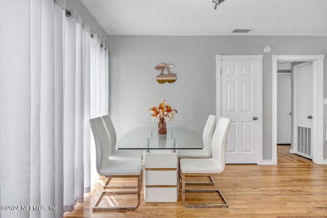 dining area with light wood-type flooring