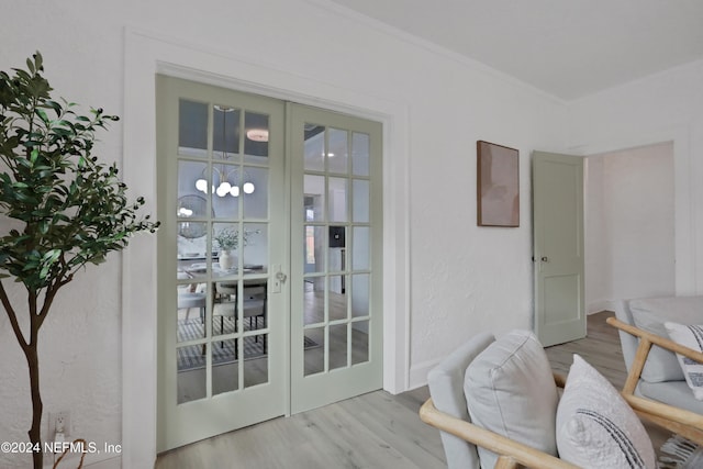 entryway with light hardwood / wood-style flooring and french doors