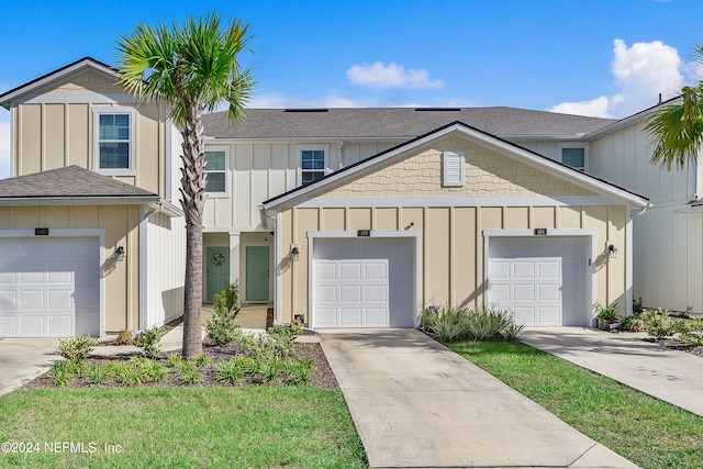 view of front facade with a front yard and a garage