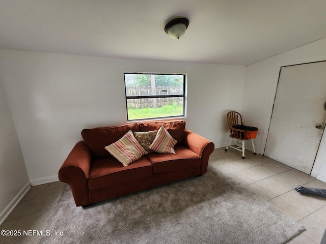 living room with tile patterned flooring