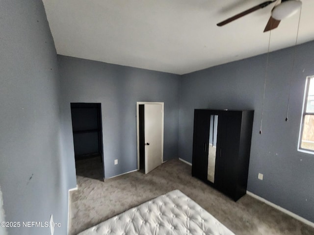 bedroom with a ceiling fan and carpet floors