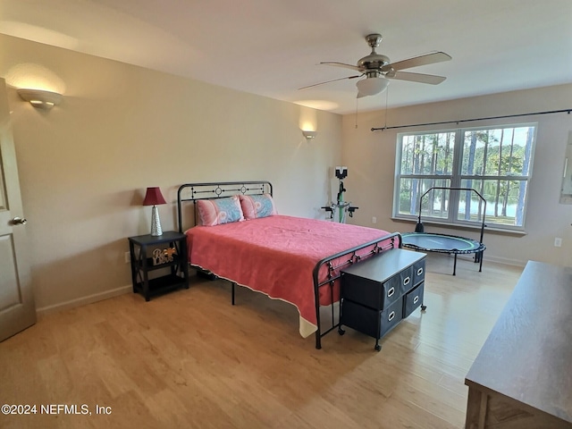 bedroom featuring light hardwood / wood-style flooring and ceiling fan