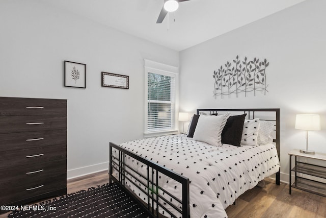 bedroom featuring hardwood / wood-style flooring and ceiling fan