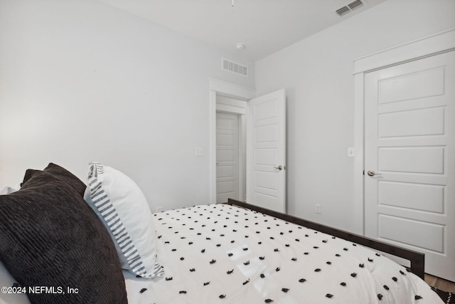 bedroom with a closet and wood-type flooring