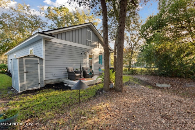 exterior space featuring a storage unit