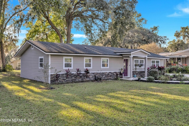 ranch-style house with a front lawn