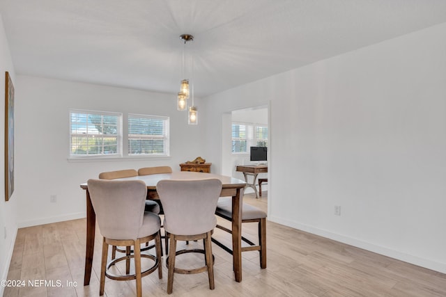 dining space featuring light wood-type flooring