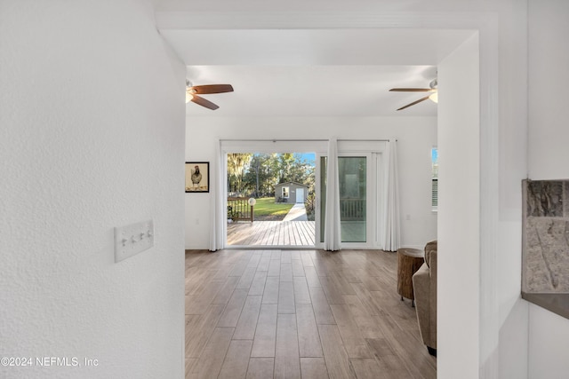 interior space featuring light wood-type flooring and ceiling fan