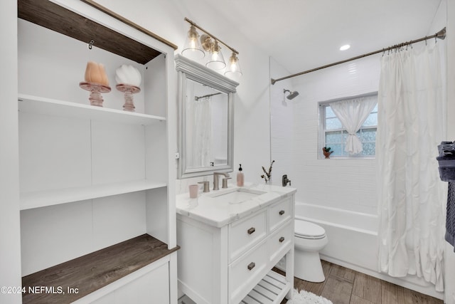 full bathroom featuring vanity, shower / tub combo with curtain, toilet, and hardwood / wood-style flooring