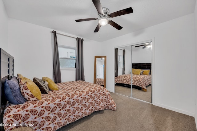 carpeted bedroom featuring a closet and ceiling fan