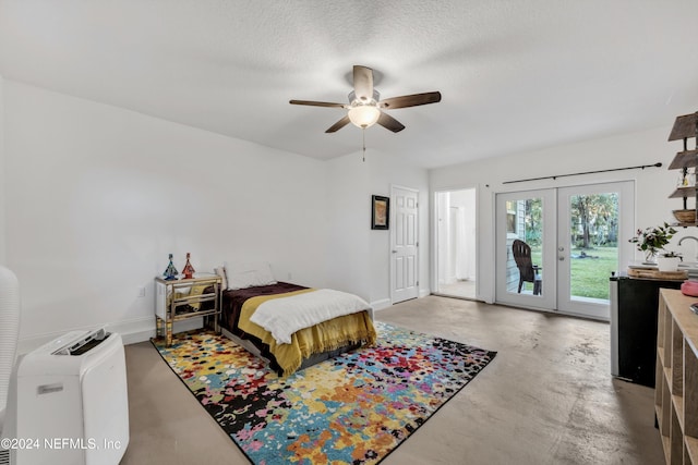 bedroom with french doors, a textured ceiling, access to exterior, and ceiling fan