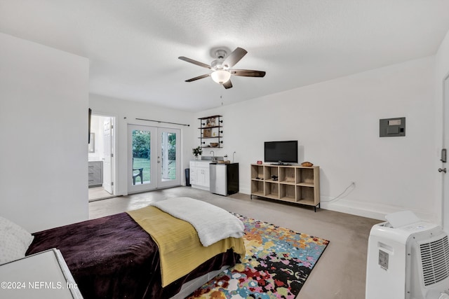 bedroom with french doors, a textured ceiling, access to exterior, and ceiling fan