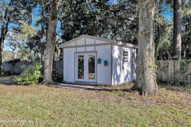 view of outbuilding with a lawn