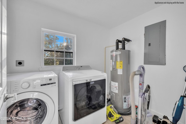 washroom featuring electric panel, electric water heater, and separate washer and dryer