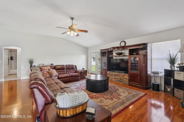 living room with vaulted ceiling, hardwood / wood-style flooring, and ceiling fan